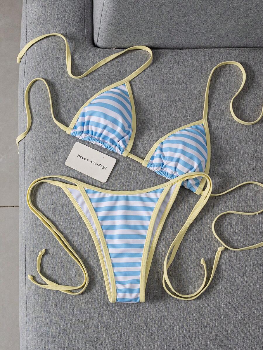 Women's two-piece halter triangle bikini set featuring a backless tie-back top with removable padding and matching tie-side mid-waist bottoms.