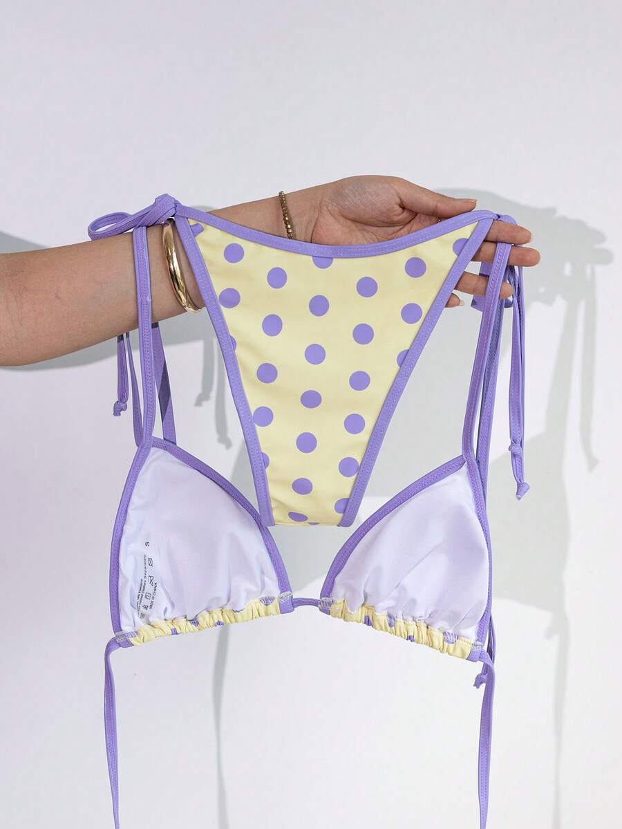 Women's two-piece halter triangle bikini set featuring a backless tie-back top with removable padding and matching tie-side mid-waist bottoms.