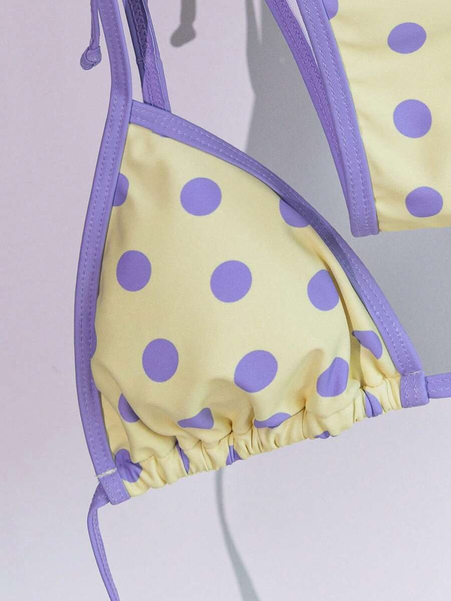 Women's two-piece halter triangle bikini set featuring a backless tie-back top with removable padding and matching tie-side mid-waist bottoms.