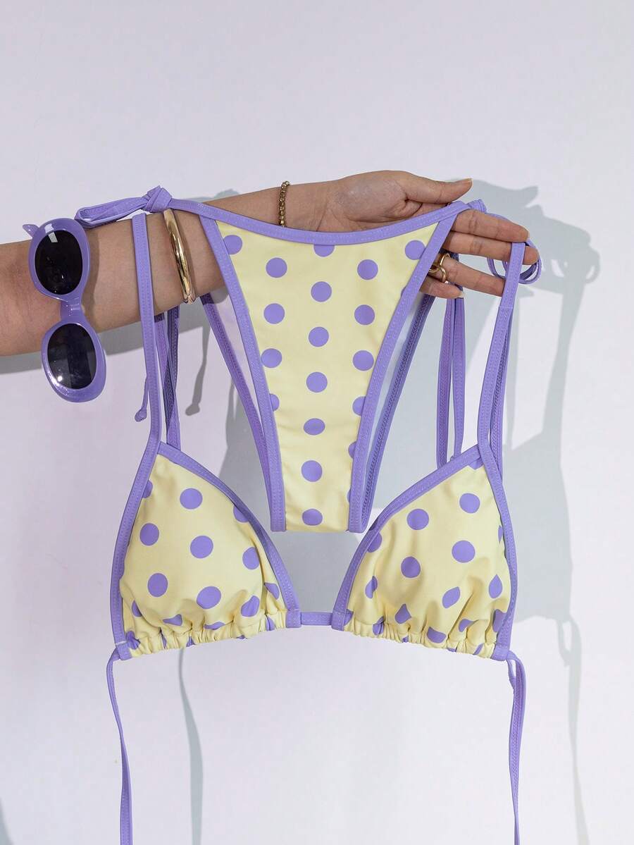 Women's two-piece halter triangle bikini set featuring a backless tie-back top with removable padding and matching tie-side mid-waist bottoms.