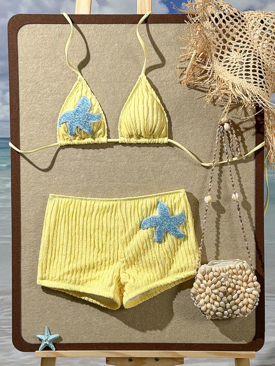 Women's apricot two-piece swimsuit set with a halter tie-back top and matching high stretch shorts.