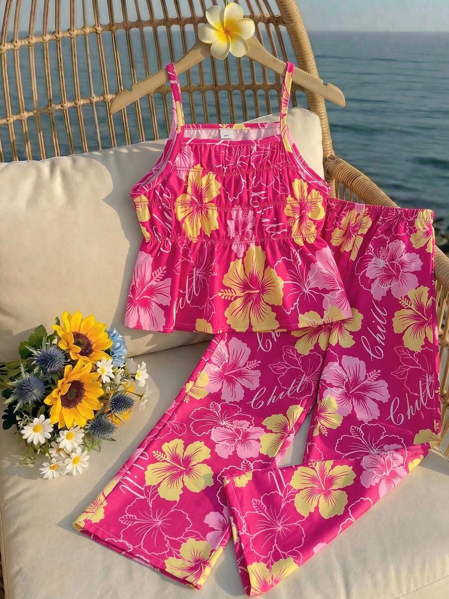 Tween girl wearing an apricot 2-piece outfit set featuring a shirred spaghetti strap short cami top and matching wide-leg long pants.