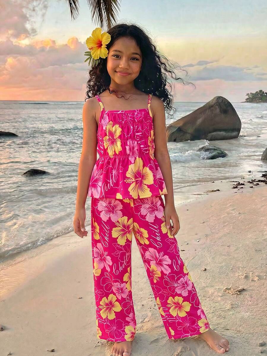 Tween girl wearing an apricot 2-piece outfit set featuring a shirred spaghetti strap short cami top and matching wide-leg long pants.