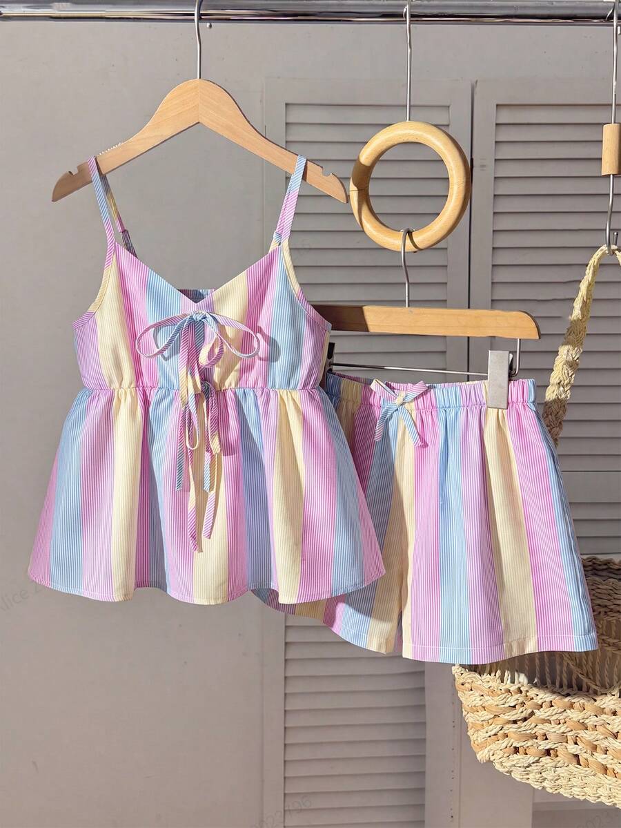 Tween girls 2-piece summer vacation set featuring a multicolored geometric print sleeveless camisole top with bow knot detail and matching elastic waist shorts.