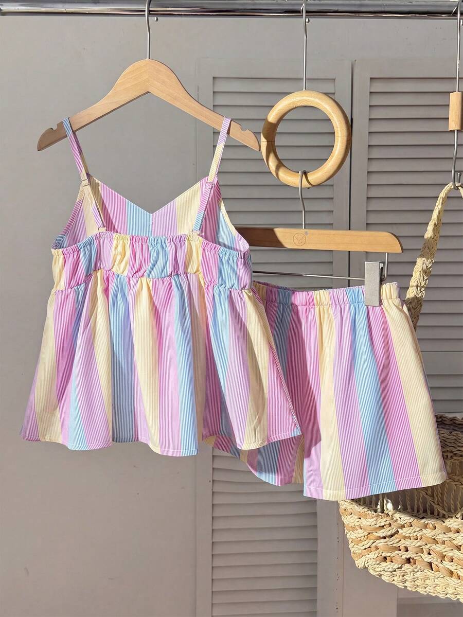 Tween girls 2-piece summer vacation set featuring a multicolored geometric print sleeveless camisole top with bow knot detail and matching elastic waist shorts.