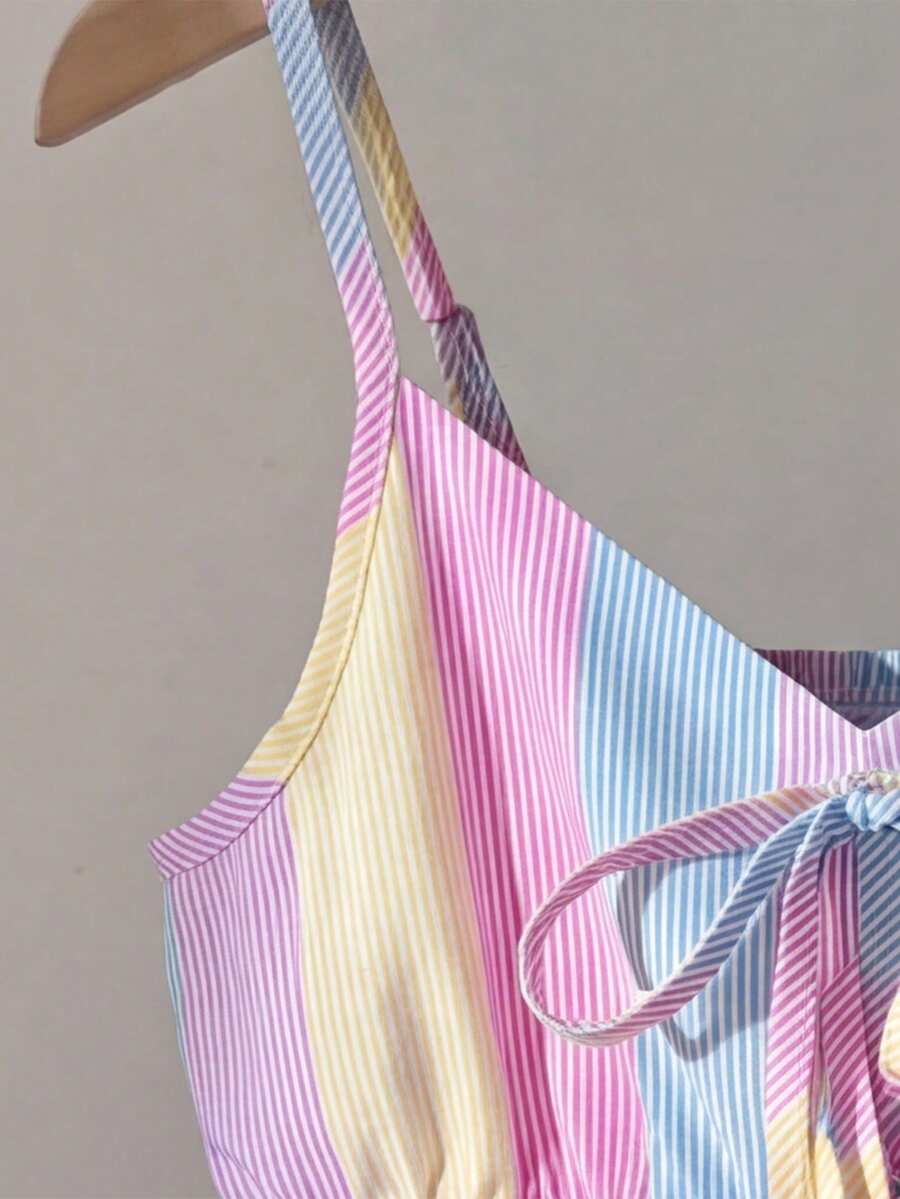 Tween girls 2-piece summer vacation set featuring a multicolored geometric print sleeveless camisole top with bow knot detail and matching elastic waist shorts.