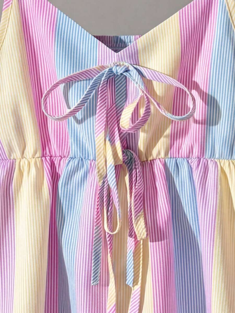 Tween girls 2-piece summer vacation set featuring a multicolored geometric print sleeveless camisole top with bow knot detail and matching elastic waist shorts.
