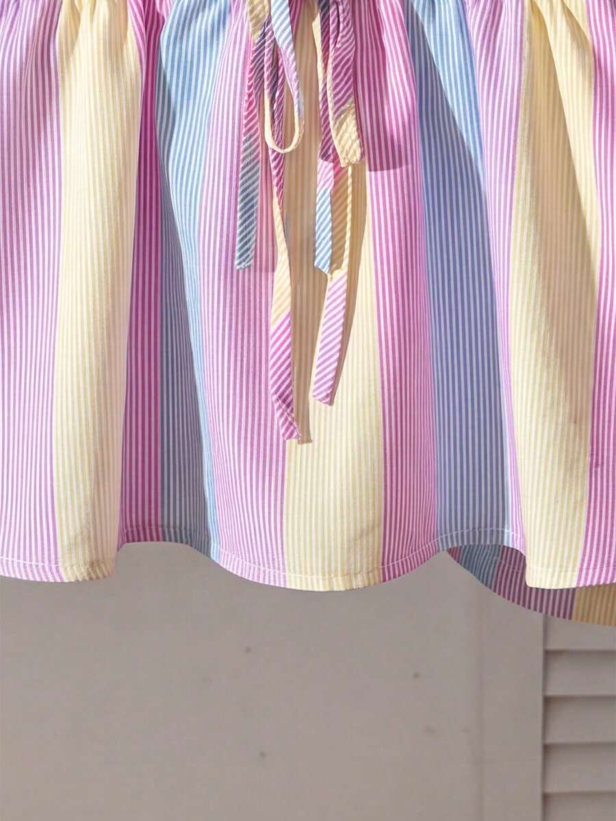 Tween girls 2-piece summer vacation set featuring a multicolored geometric print sleeveless camisole top with bow knot detail and matching elastic waist shorts.