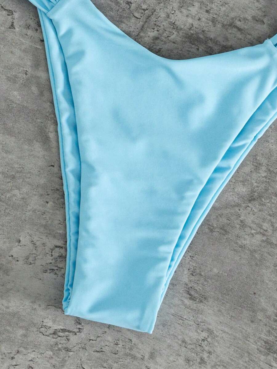 Women's solid yellow 2-piece bikini set featuring a high-waist bottom and a wireless bandeau top on display for beach and resort wear.