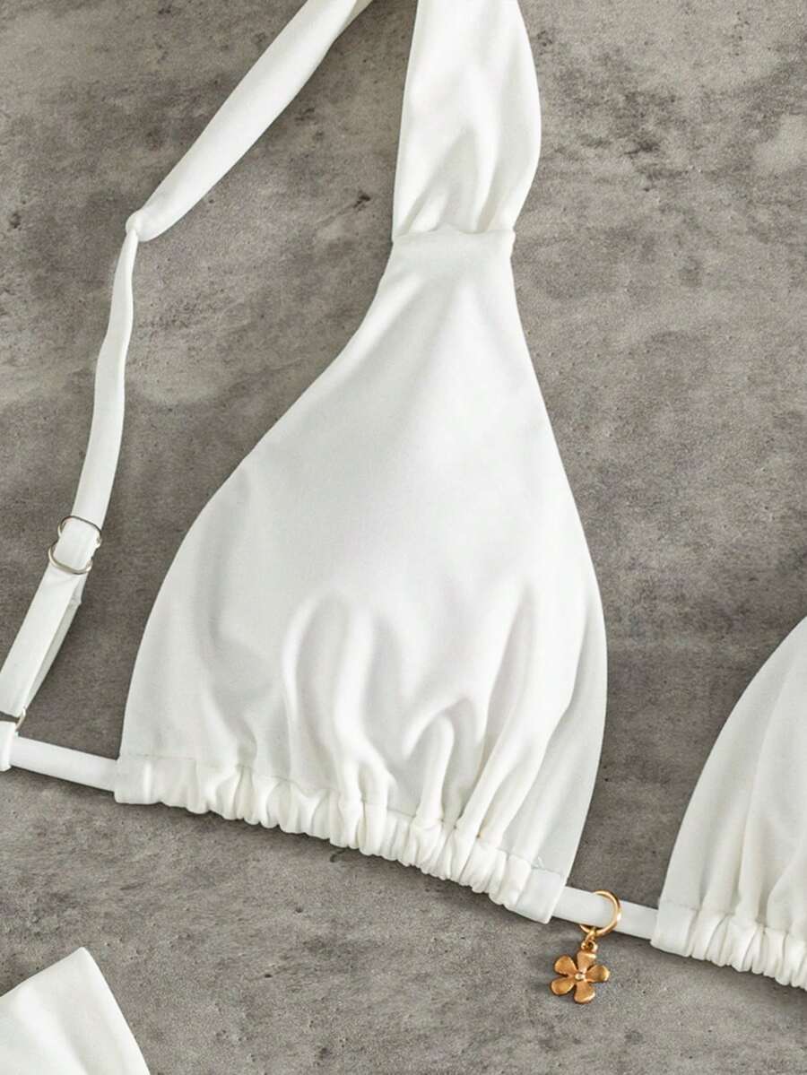 Women's solid yellow 2-piece bikini set featuring a high-waist bottom and a wireless bandeau top on display for beach and resort wear.