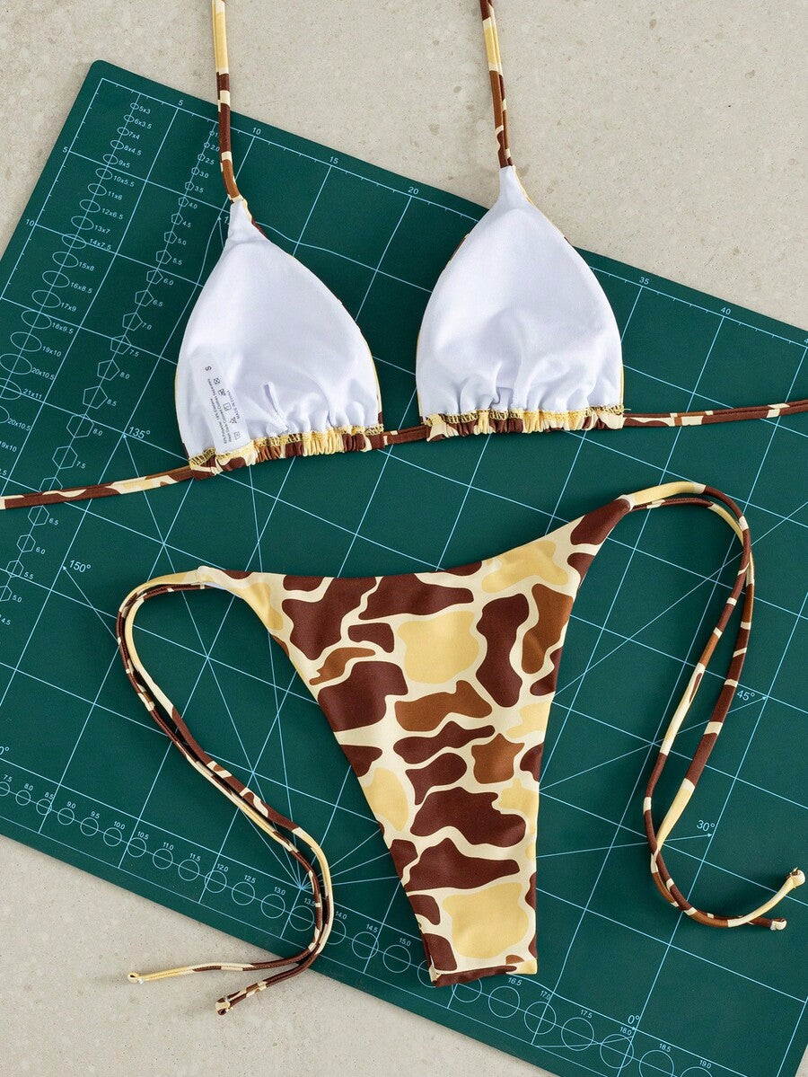 Women's two-piece black bikini set showing a halter triangle tie-back top and matching side-tie bikini bottoms.