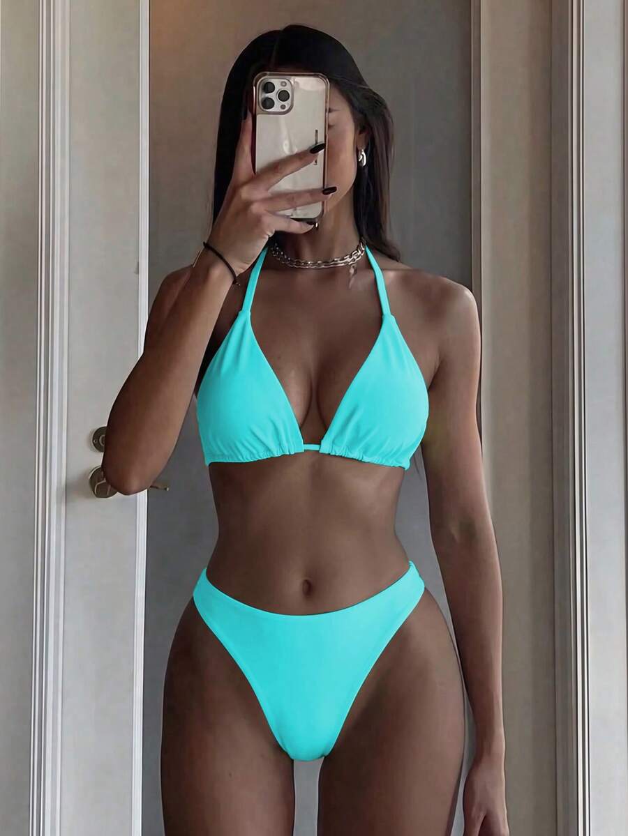 Women's two-piece halter bikini set featuring high cut thong bottoms and removable padding