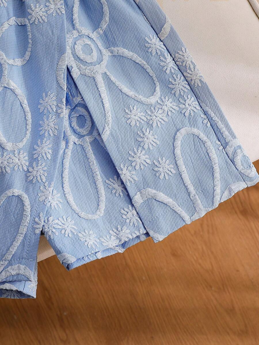 Tween girls 2-piece blue outfit featuring a short sleeve round neck t-shirt with a bow front detail and an asymmetric wrap skort.