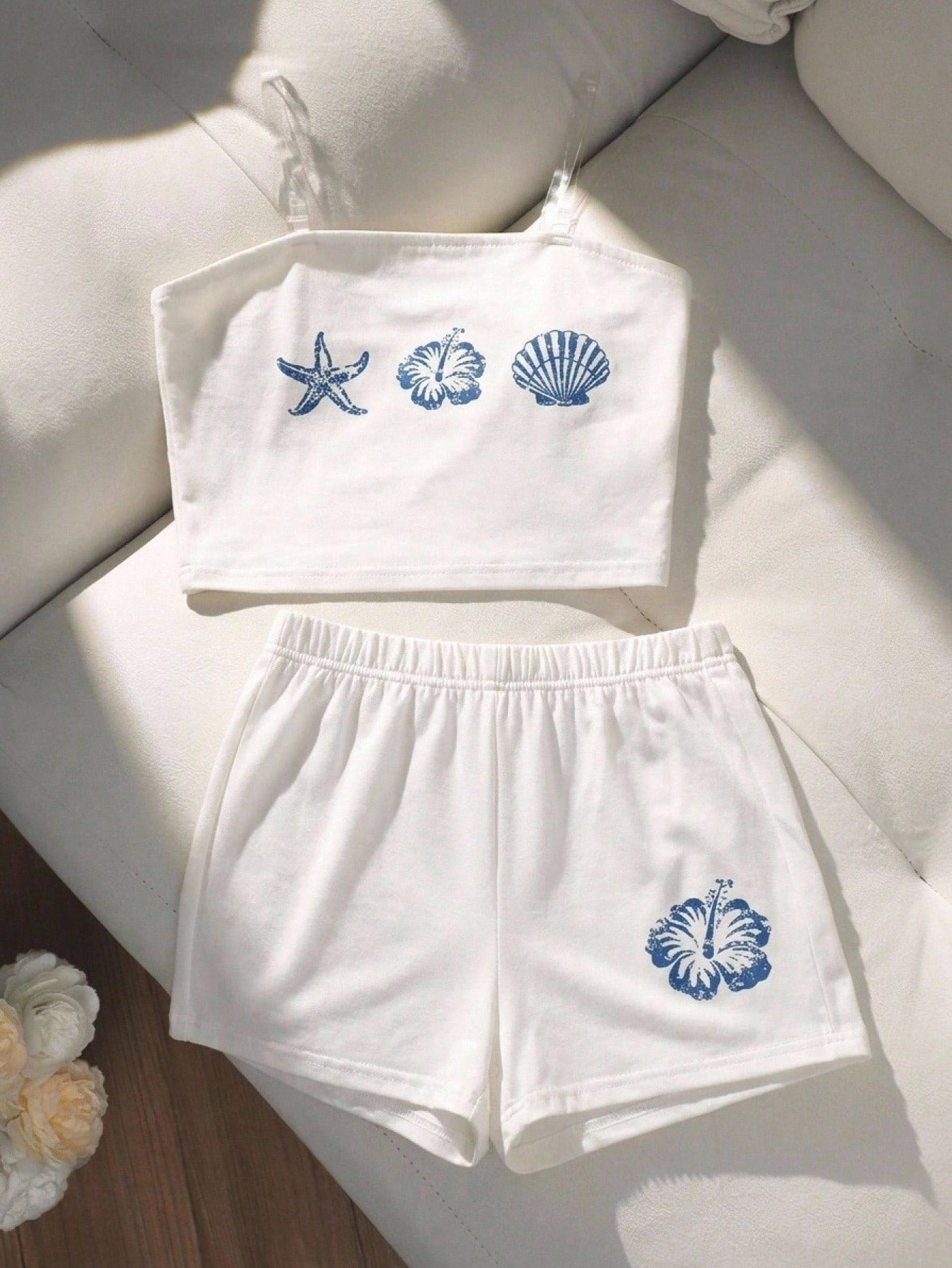 Tween girls summer 2-piece Hawaiian style outfit featuring a graphic print spaghetti strap camisole top with contrast piping and matching casual shorts.