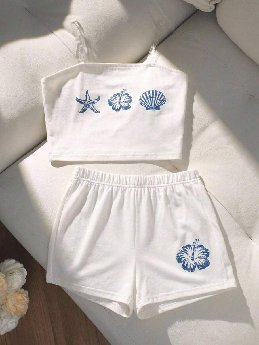 Tween girls summer 2-piece Hawaiian style outfit featuring a graphic print spaghetti strap camisole top with contrast piping and matching casual shorts.