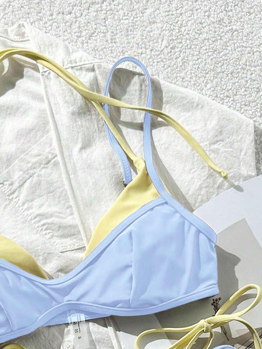 Women's retro polka dot high waist bikini swimsuit set with spaghetti straps and knot tie-back top.