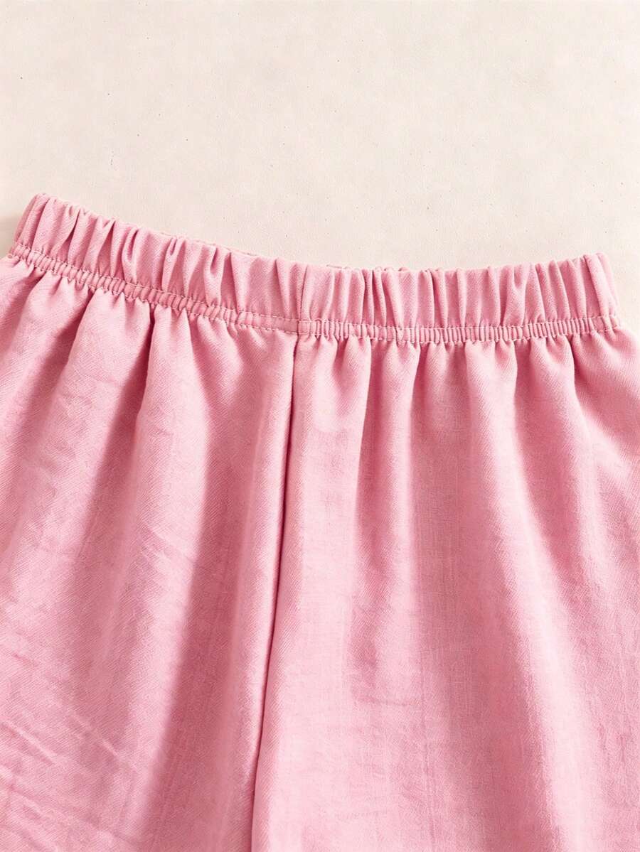 Tween girls 2-piece bohemian outfit set in apricot featuring a square neck embroidered sleeveless camisole top and matching floral wide leg shorts.