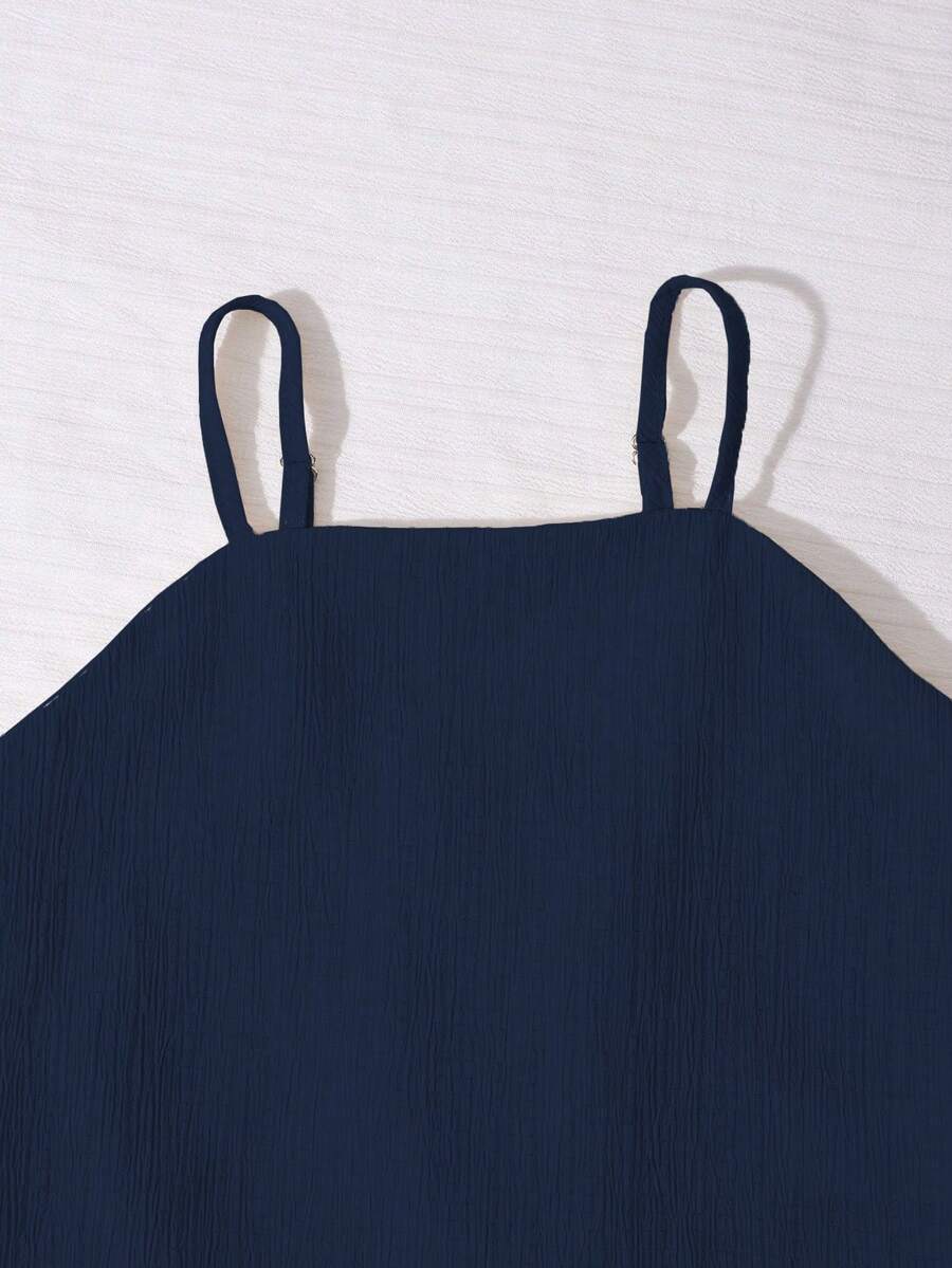 Tween girls casual 2-piece set featuring an apricot woven camisole crop top with back shirring and matching high-waisted loose long pants.