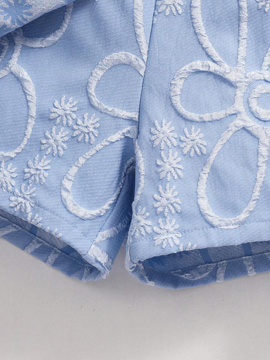 Tween girls 2-piece blue outfit featuring a short sleeve round neck t-shirt with a bow front detail and an asymmetric wrap skort.