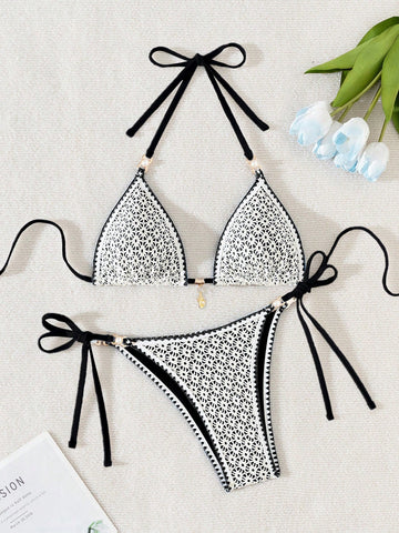 Women's triangle bikini set with contrast lace wireless bra top and ultra high waist tie side bottoms.