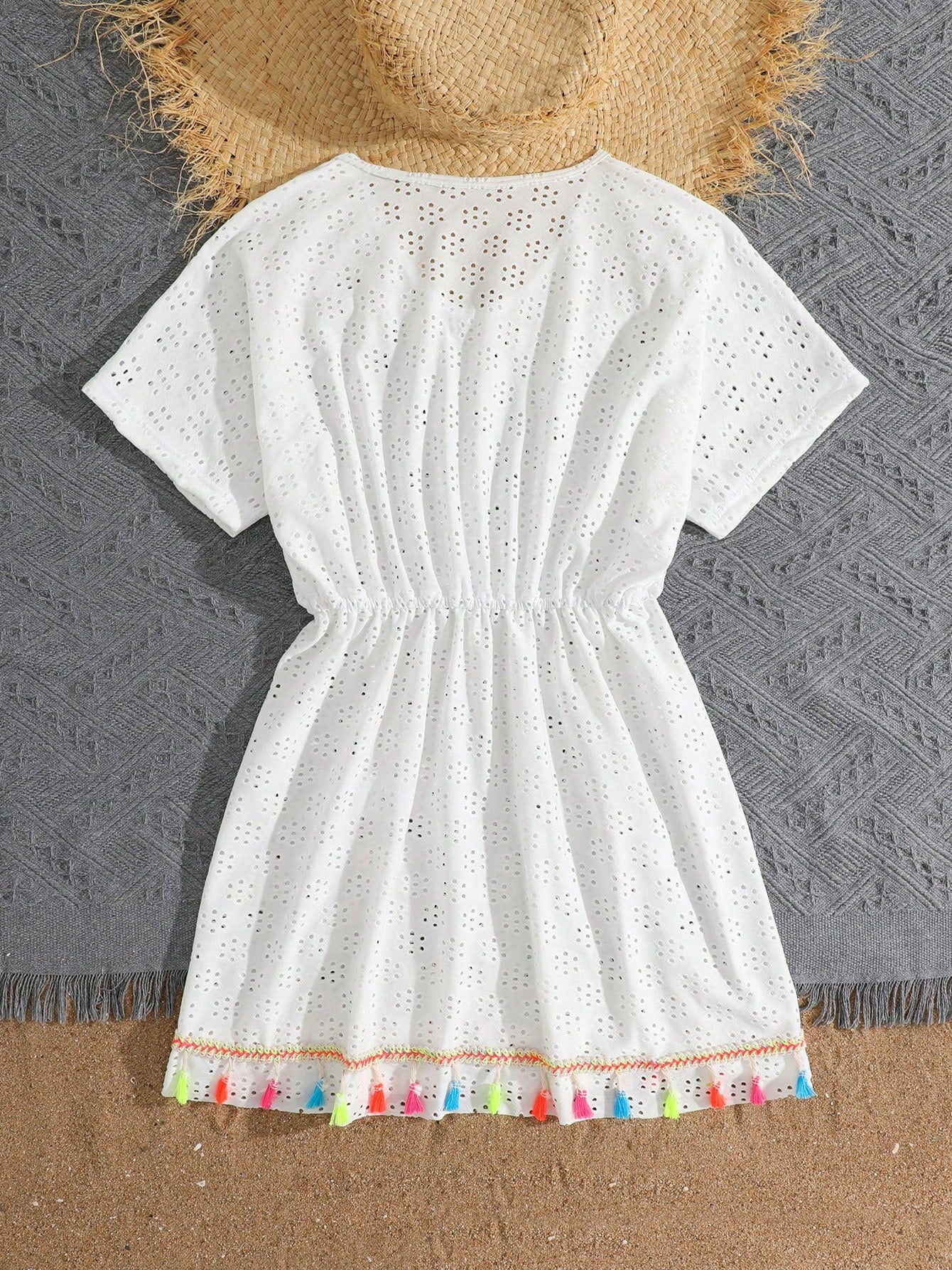 White tween girls swimsuit cover-up with V neck, short sleeves, contrast lace, fringe details, and regular length mesh fabric for beachwear