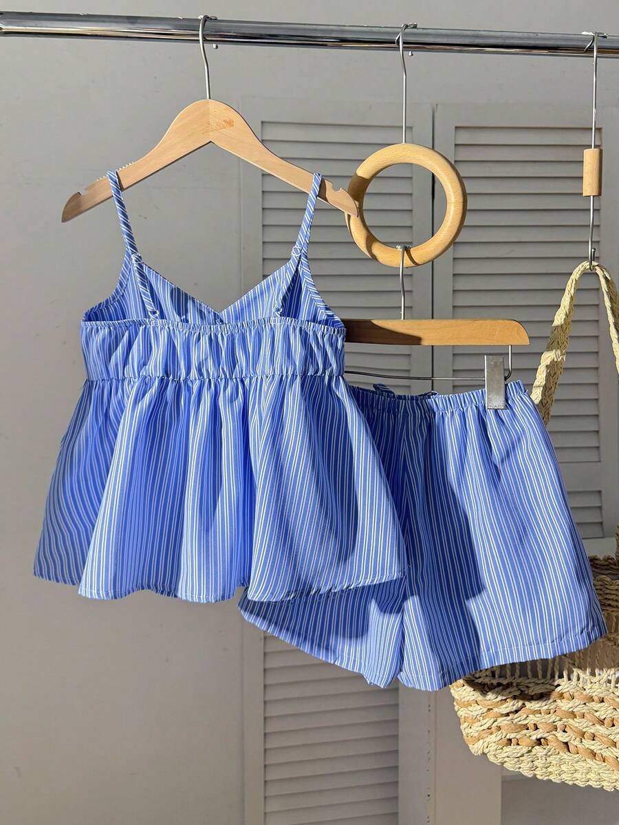 Tween girl 2-piece summer set with a black and white sleeveless striped spaghetti strap tank top with ruffle details and matching casual shorts.