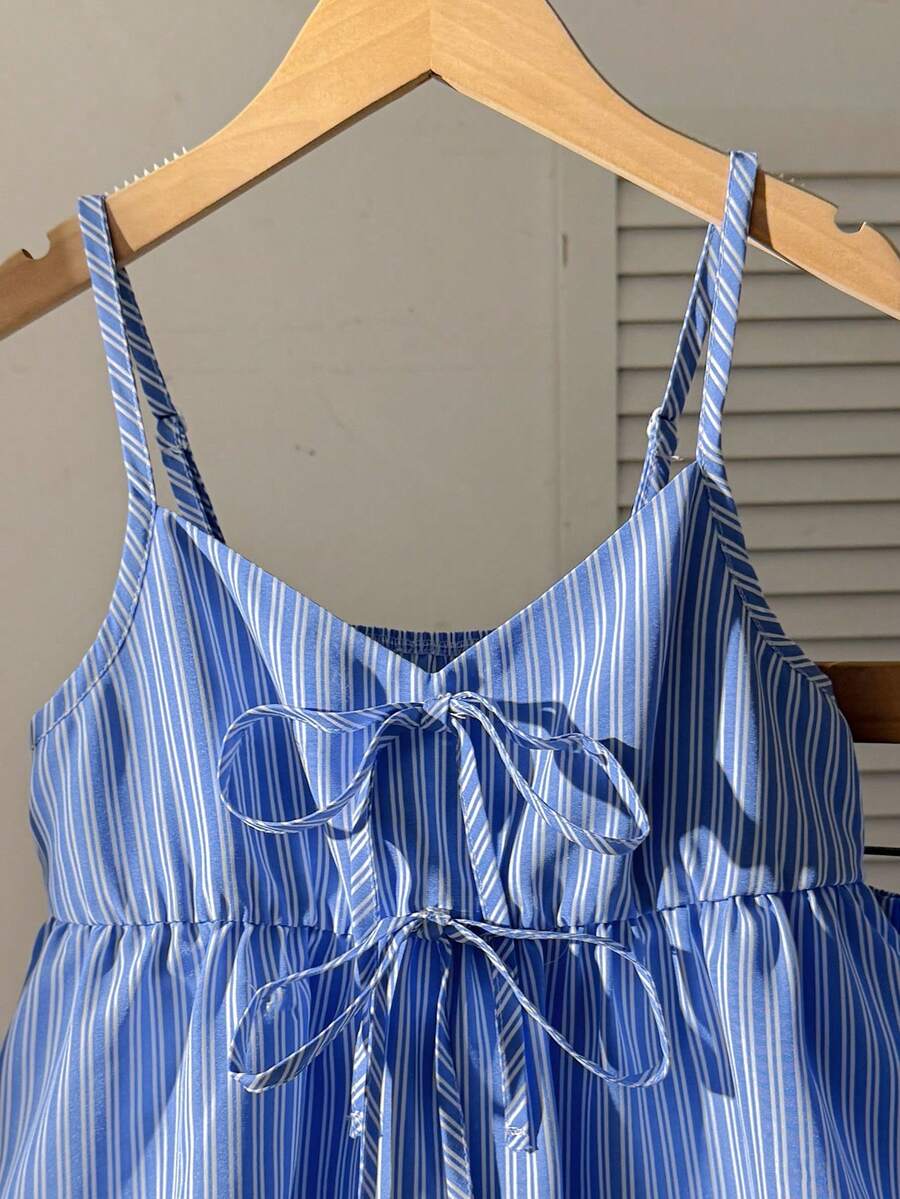 Tween girl 2-piece summer set with a black and white sleeveless striped spaghetti strap tank top with ruffle details and matching casual shorts.