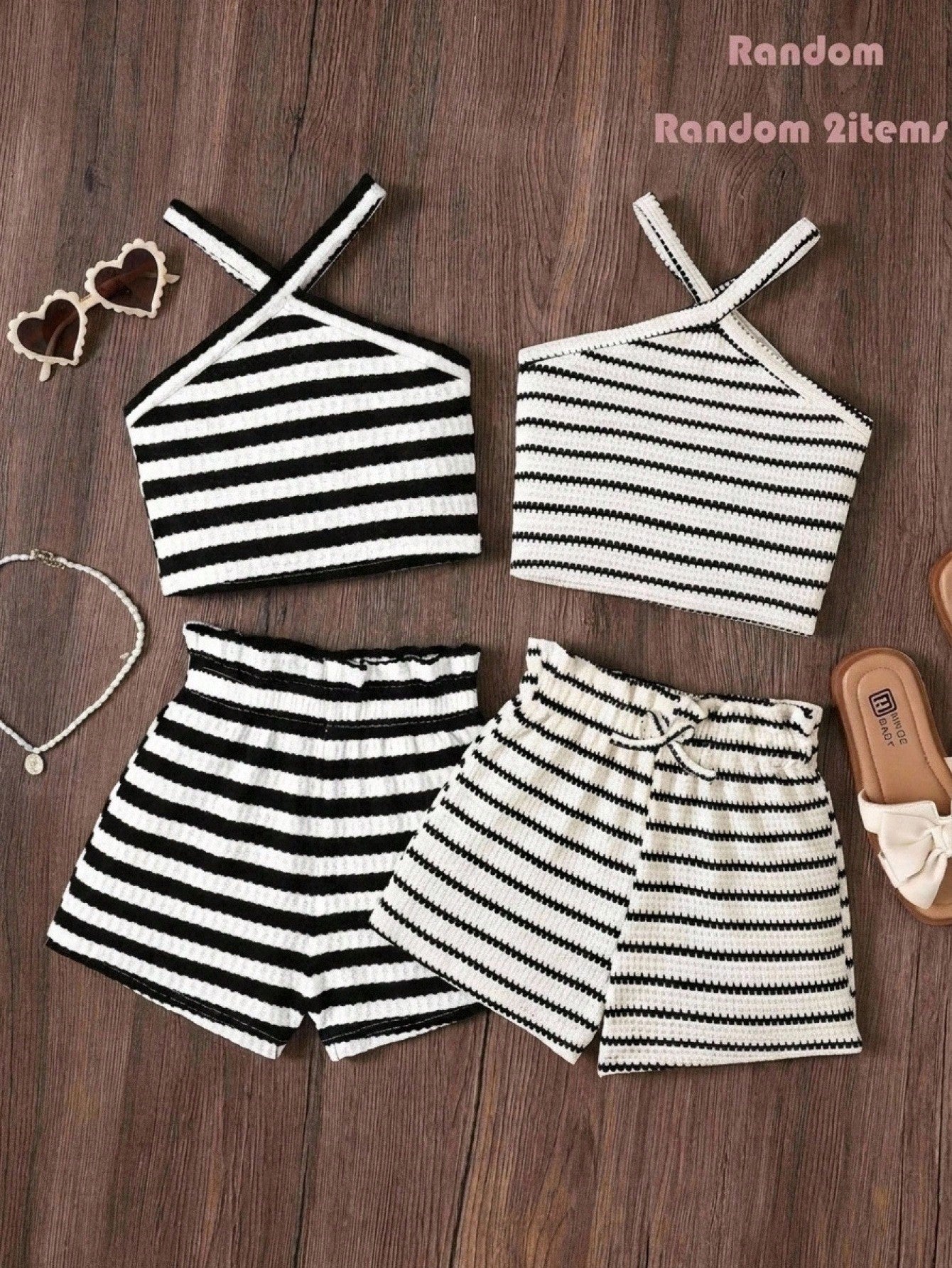 Black and white striped 2-piece set for tween girls featuring a halter sleeveless pullover top with criss-cross knot detail and matching paperbag waist shorts.