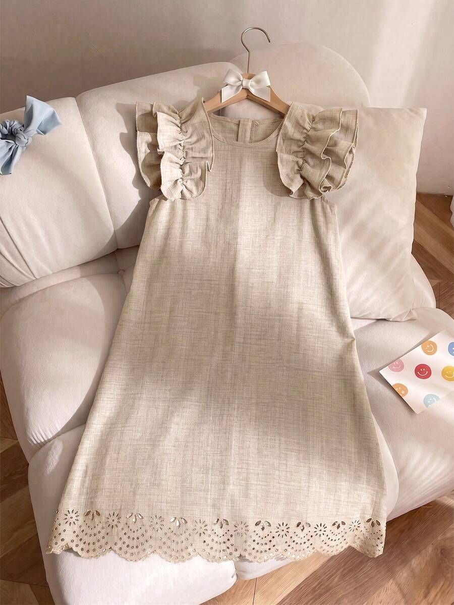Tween girls apricot vacation midi dress featuring a round neck, cut out details, ruffle flounce accents, and geometric pattern.