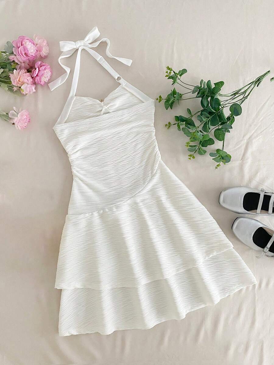 Tween girls apricot sleeveless halter mini dress with textured starfish and shell decor, shirred tiered layer, high waist, and flounce hem.