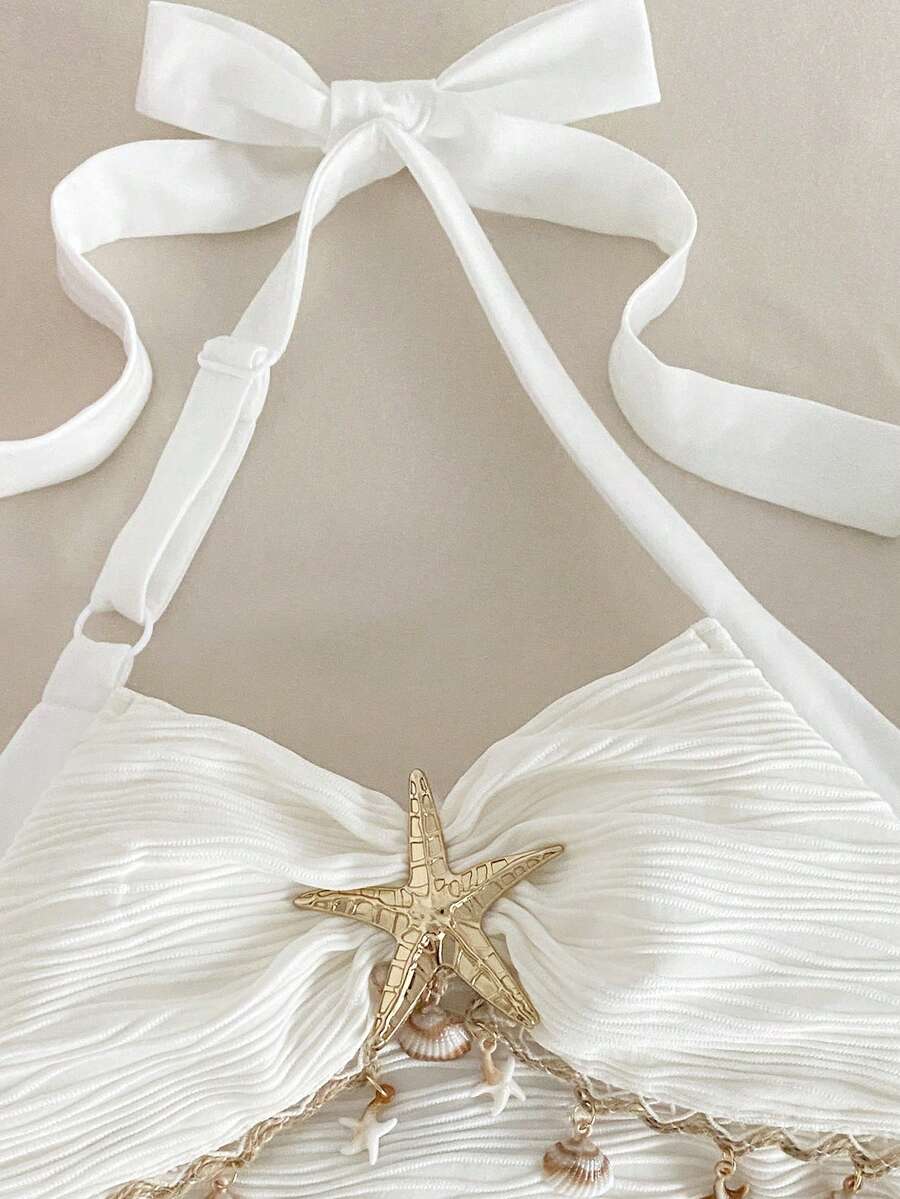 Tween girls apricot sleeveless halter mini dress with textured starfish and shell decor, shirred tiered layer, high waist, and flounce hem.
