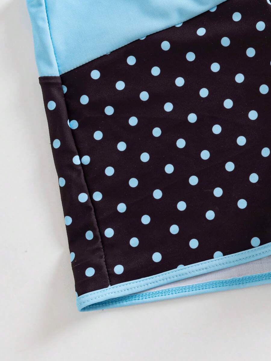 Women's retro pink and blue cartoon sardine print halter two-piece swimwear featuring a high waist shorts bottom and wireless bra with removable padding.