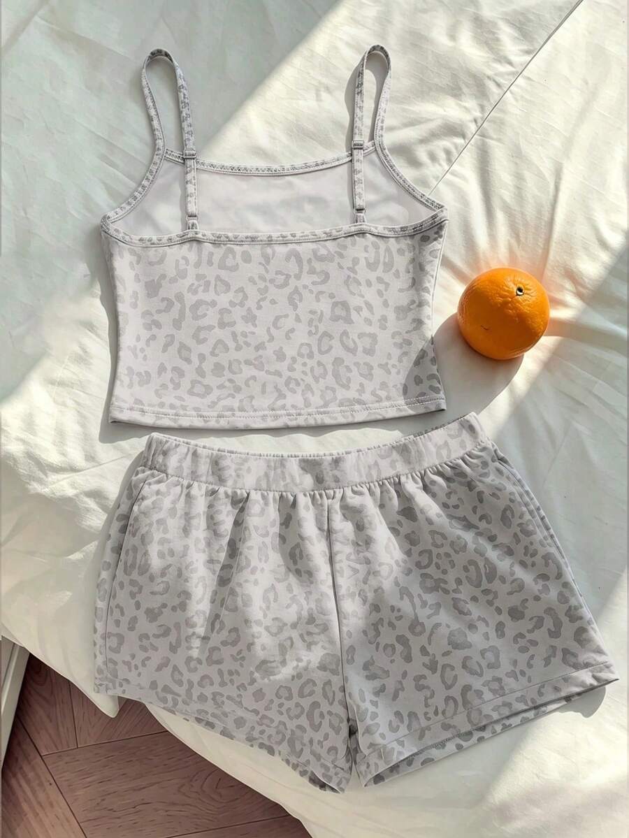 Tween girls summer 2-piece Hawaiian style outfit featuring a graphic print spaghetti strap camisole top with contrast piping and matching casual shorts.
