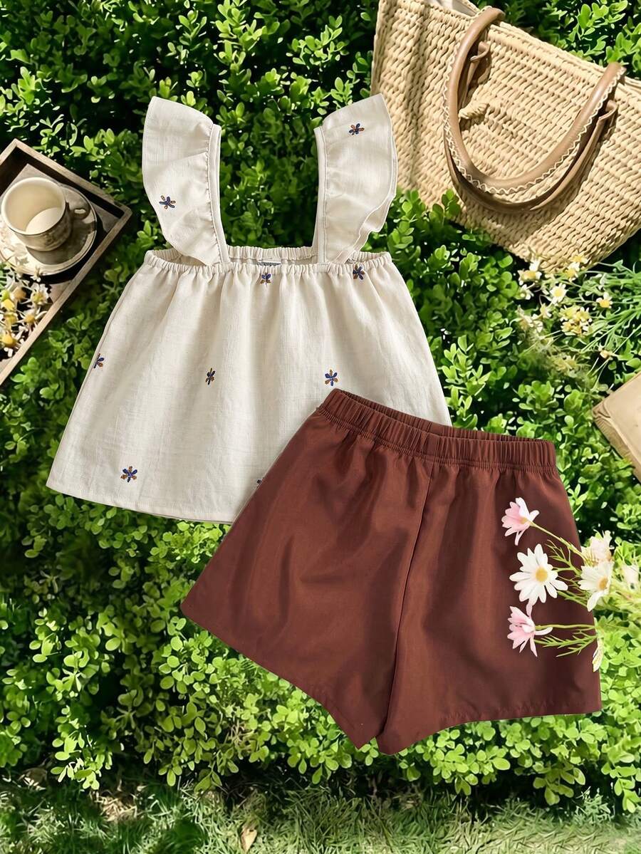 Tween girls 2-piece bohemian outfit set in apricot featuring a square neck embroidered sleeveless camisole top and matching floral wide leg shorts.