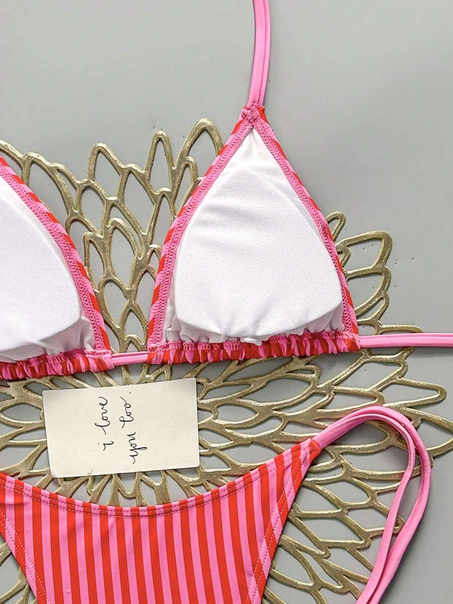 Women's black halter bikini set featuring triangle cups with gold bead decor and tie-back closure