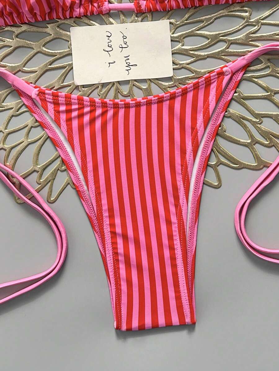 Women's black halter bikini set featuring triangle cups with gold bead decor and tie-back closure