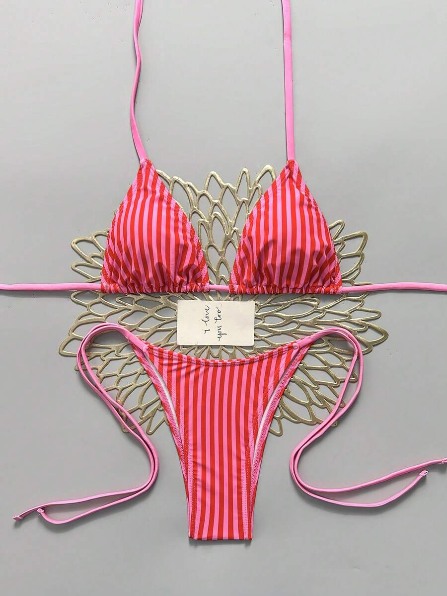 Women's black halter bikini set featuring triangle cups with gold bead decor and tie-back closure