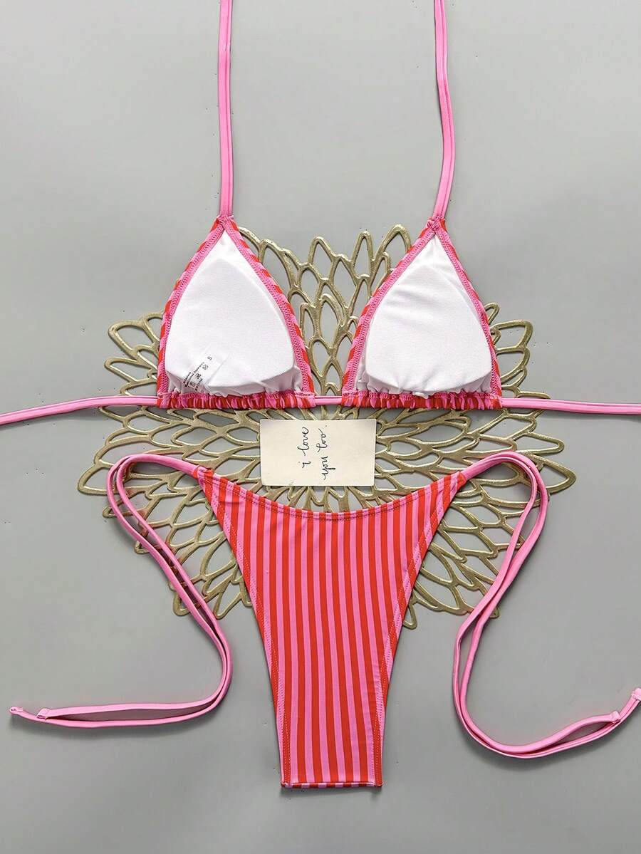 Women's black halter bikini set featuring triangle cups with gold bead decor and tie-back closure