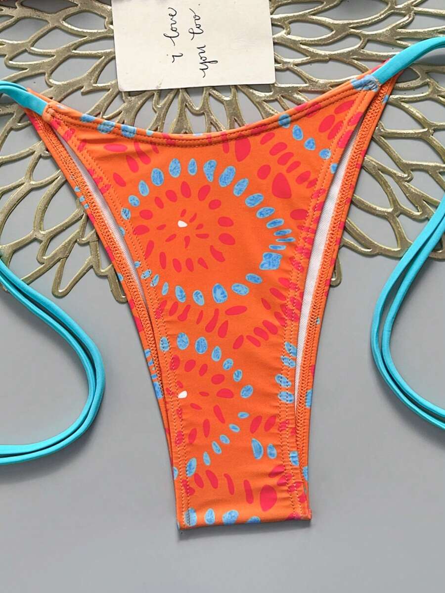 Women's black halter bikini set featuring triangle cups with gold bead decor and tie-back closure