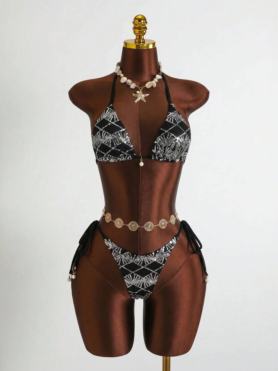 Women's 3-piece blue tropical shell print bikini set featuring a halter bralette top, low-waist tie-side bottom, and a matching sheer mesh cover-up skirt.