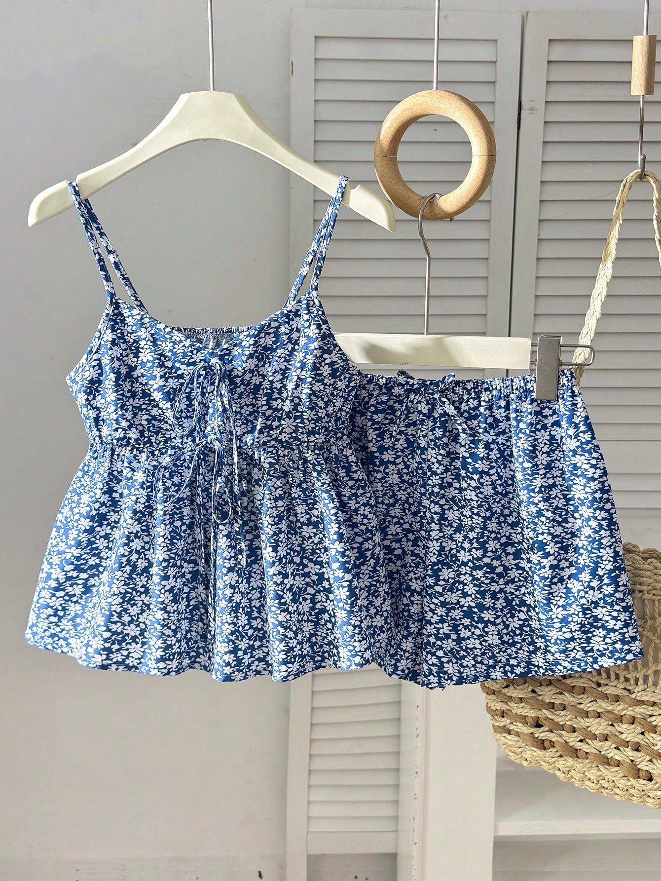 Tween girl 2-piece summer set with a black and white sleeveless striped spaghetti strap tank top with ruffle details and matching casual shorts.