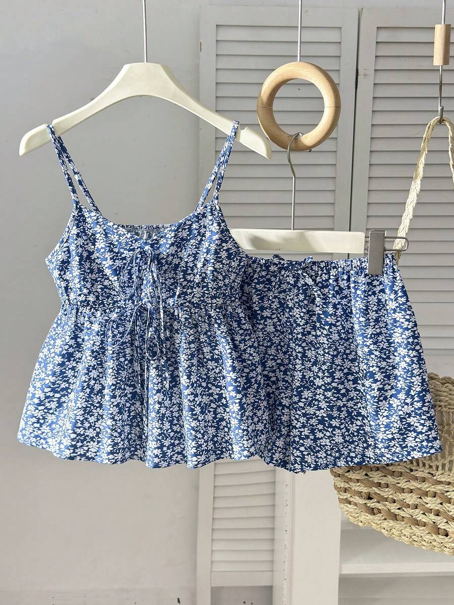Tween girl 2-piece summer set with a black and white sleeveless striped spaghetti strap tank top with ruffle details and matching casual shorts.