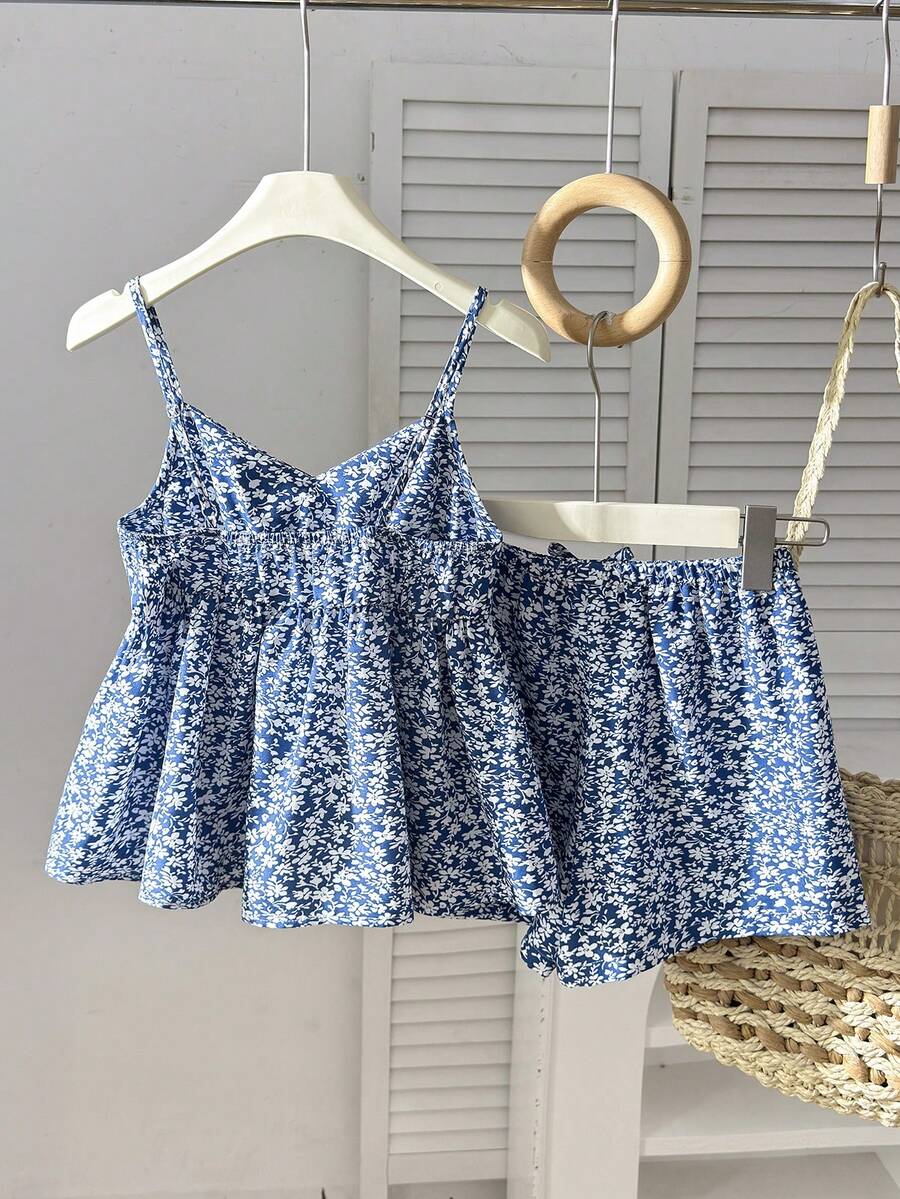 Tween girl 2-piece summer set with a black and white sleeveless striped spaghetti strap tank top with ruffle details and matching casual shorts.