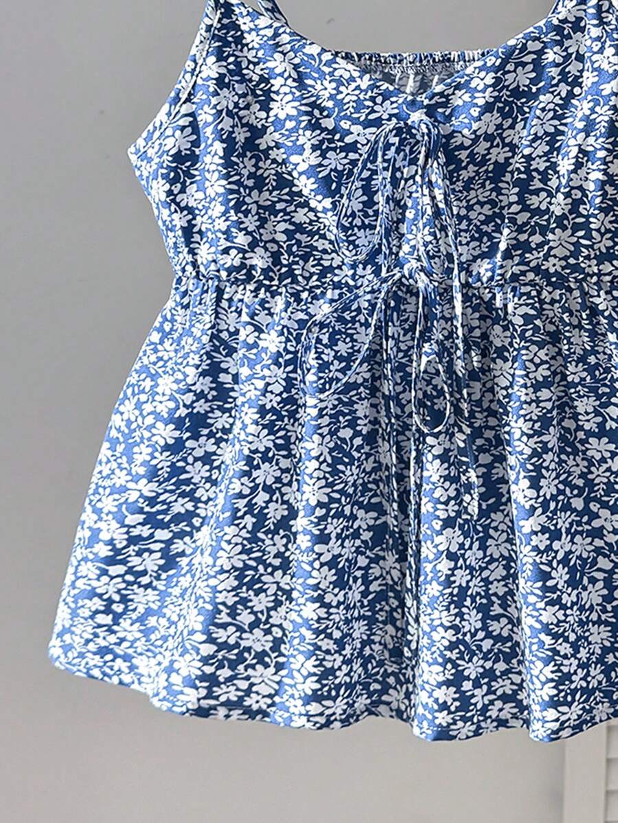 Tween girl 2-piece summer set with a black and white sleeveless striped spaghetti strap tank top with ruffle details and matching casual shorts.