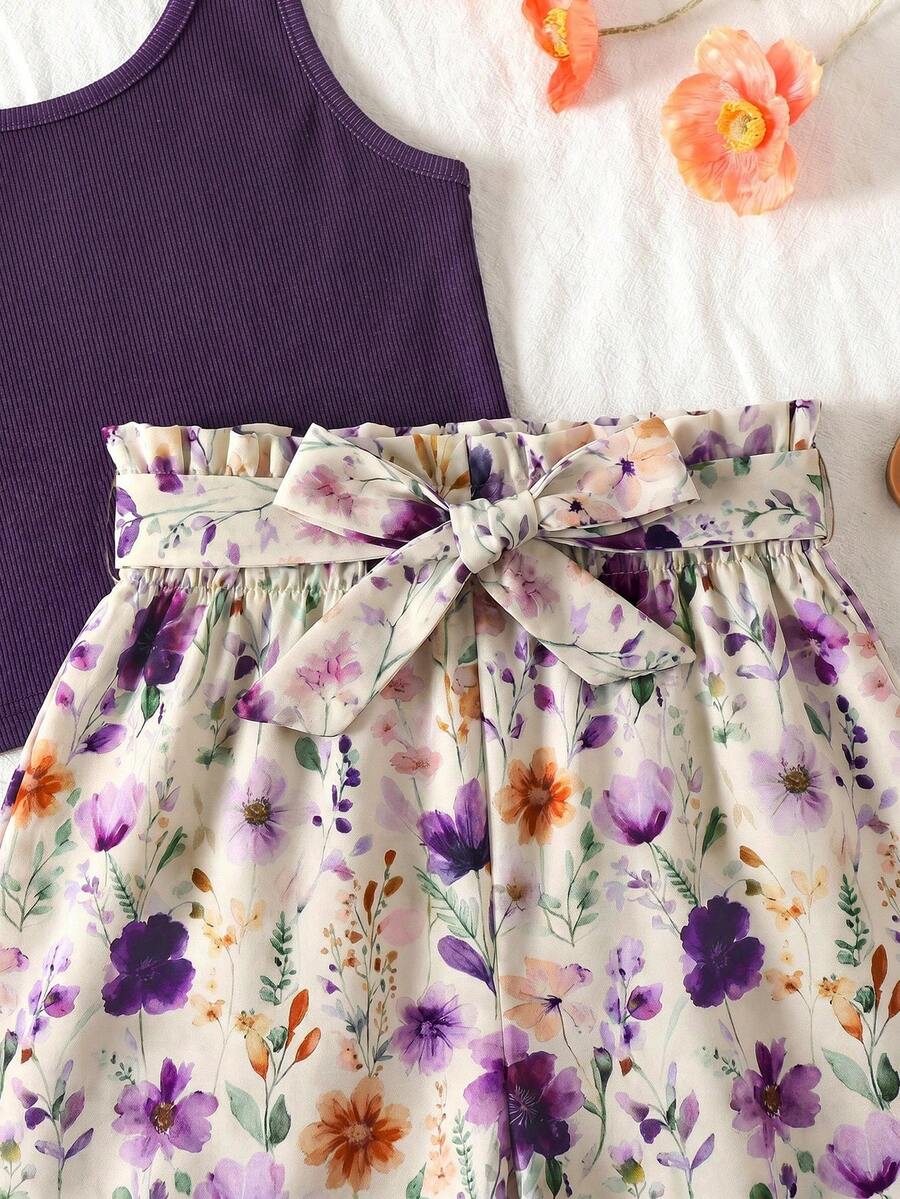 Tween girls 2-piece summer set featuring a turquoise blue ribbed tank top and tropical leaf pattern belted shorts.