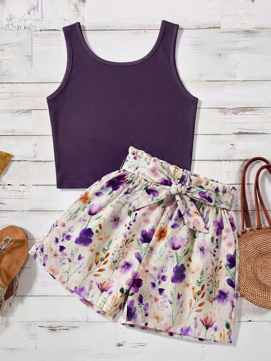 Tween girls 2-piece summer set featuring a turquoise blue ribbed tank top and tropical leaf pattern belted shorts.