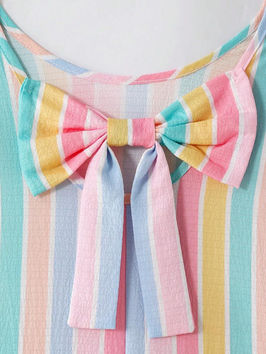 Tween girls apricot vacation midi dress featuring a round neck, cut out details, ruffle flounce accents, and geometric pattern.