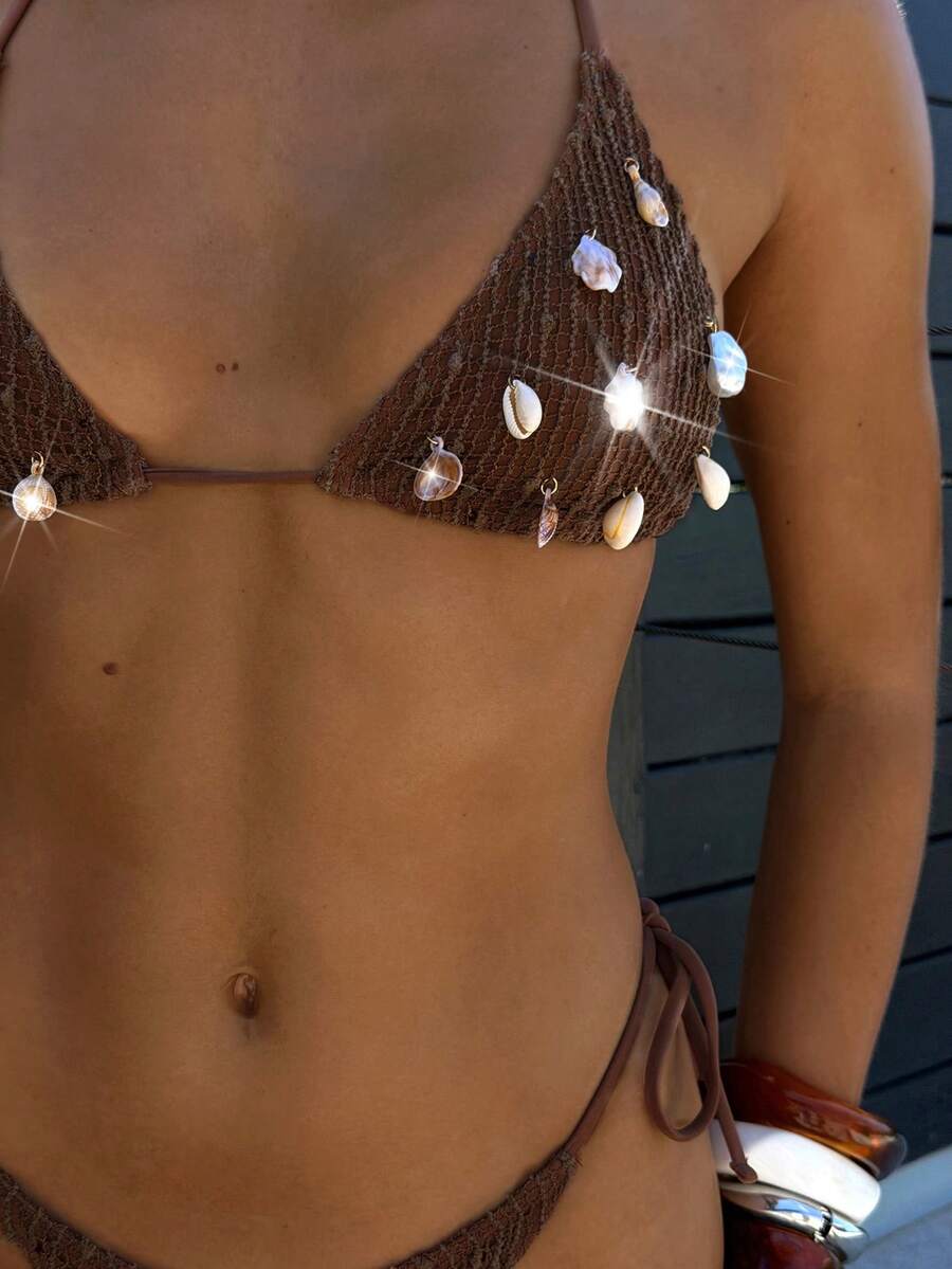 Black high-waisted bikini set featuring a halter wireless triangle top and adjustable tie-side bottoms for women.