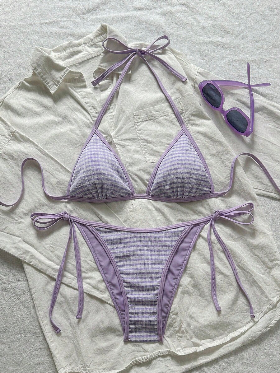 Women's apricot solid halter tie bikini top with triangle cups and matching tie-side swimsuit bottoms.