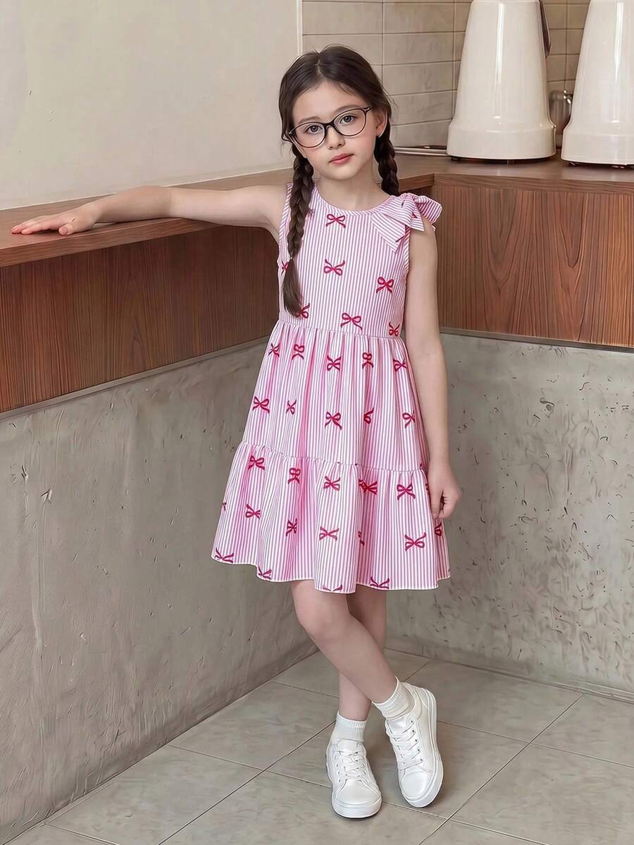 Tween girls blue striped sleeveless smock dress featuring a round neckline, high waist, and flounce ruffle hem.